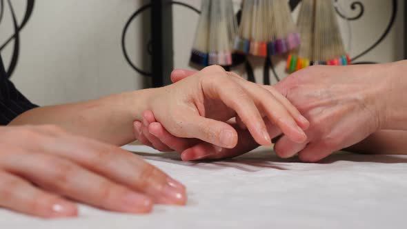 Beautician Makes Spa Care Treatments for Female Hands