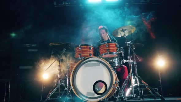 A Man Is Rehearsing His Drumming Skills in a Studio. Drum Kit, Drummer Playing on Drums