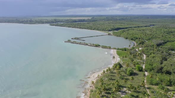 Soco river mouth and surrounding landscape in Dominican Republic. Aerial forward