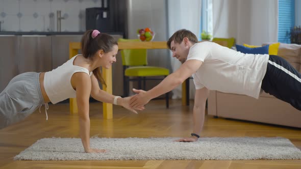 Morning Fit Workout of Lovely Young Couple at Home