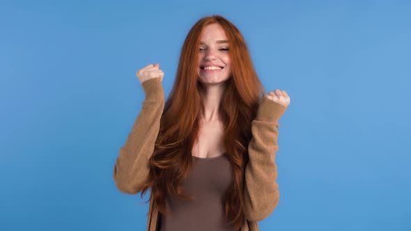 Redhaired Model in Brown Tshirt and Cardigan