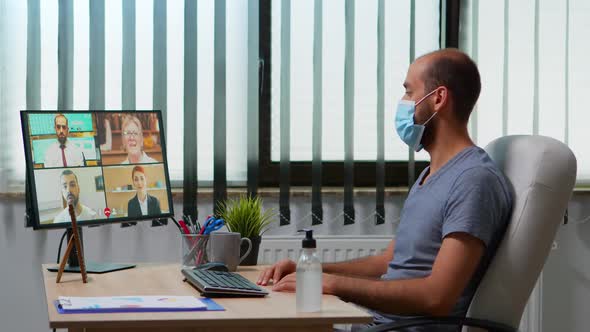 Man Having Video Call with Remote Team