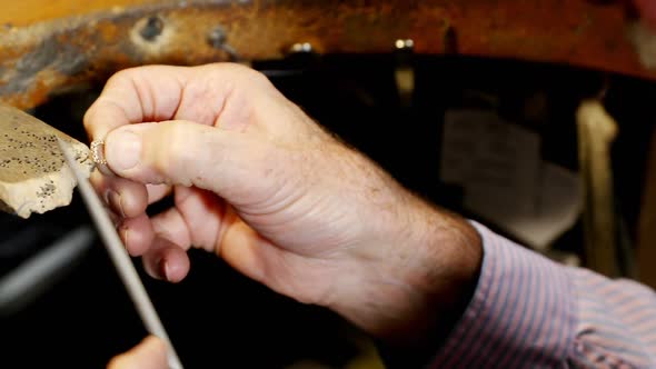 Goldsmith preparing ring