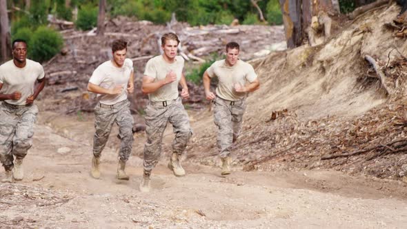 Military soldiers jogging at boot camp 4k