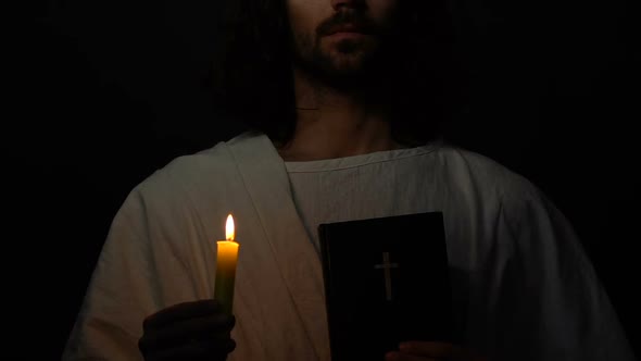 Jesus Christ in Crown of Thorns Holding Holy Bible and Burning Candle, Prophet