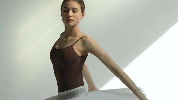 An Attractive Young Ballerina Is Dancing Elements of Classical Ballet. Self Preparation