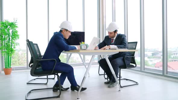 Engineer and Architect Meeting at Office Table