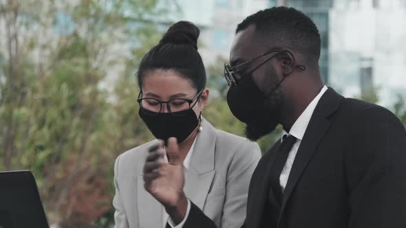 Businesspeople in Face Masks Working Outdoors