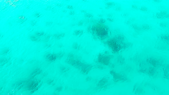 Sea Surface in a Turquoise Lagoon Top View