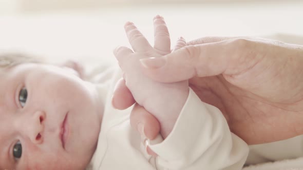 Close-up portrait of a young baby who has recently been born.