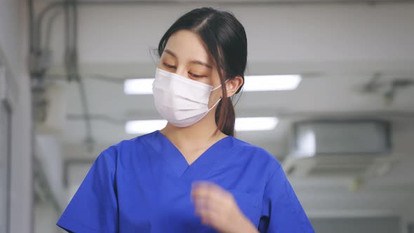 Young Tired Covid Health Worker Removing Face Shield