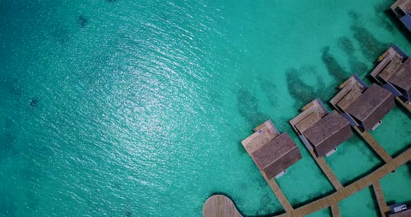 Tropical aerial clean view of a white sand paradise beach and aqua blue water background in high res