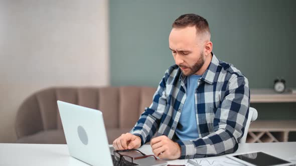 Upset Freelancer Man Having Work Problem Stress Sitting on Desk