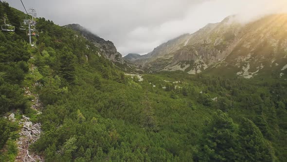 Drone Shot Moving Cableway Above Mountain Slope