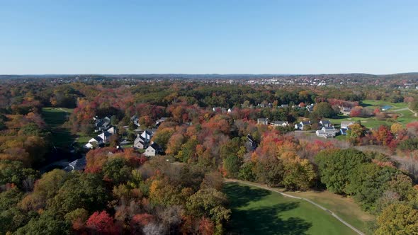 Township of Haverhill with autumn tree colors, drone ascend view