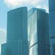 Modern office buildings on background of running clouds. Skyscrapers - VideoHive Item for Sale