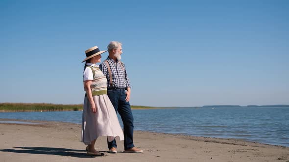 Happy Mature Senior Couple Stand on the Seashore Beautiful Romantic Elderly Middleaged Grandparents