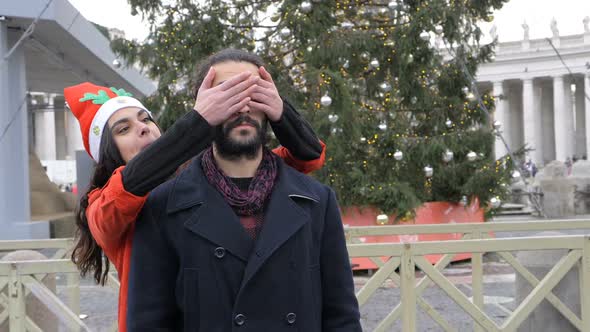 Young Woman Joking with Her Boyfriend at Christmas