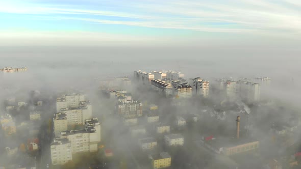 Aerial View at the Houses That Are Covered with Morning Fog. Flight Over the City of Lviv in Ukraine