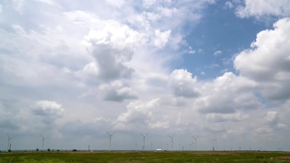 Time lapse of clouds moving over windmills in Texas
