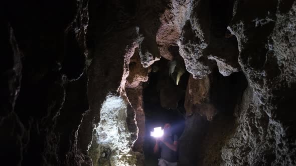 A Man Explores the Caves in the Dungeon