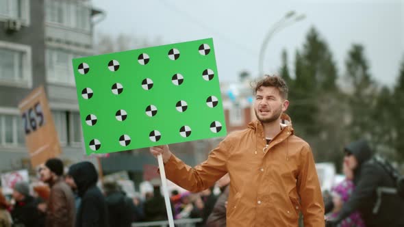 Angry Man Activist on Political Strike. People with Banner Tracking Points .