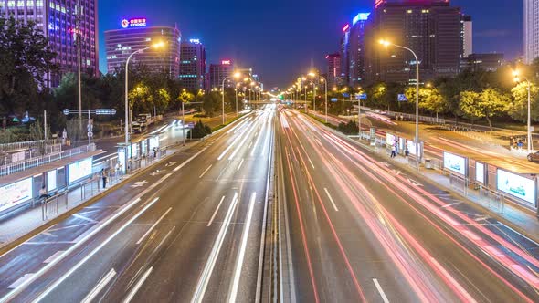 Time lapse of busy traffic and modern buildings in Beijing city , China.