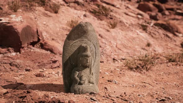 Ancient Statue on the Rocks Desert