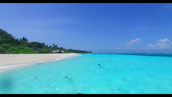 Aerial drone view panorama of luxury tourist beach trip by turquoise water with white sandy backgrou