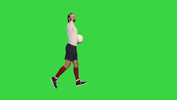 Football Player Running in Front of the Stands After He Scored on a Green Screen Chroma Key