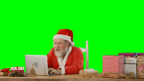 Santa claus using laptop