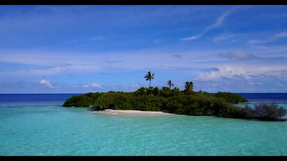 Aerial travel of relaxing coast beach vacation by blue sea with white sand background of a daytrip n