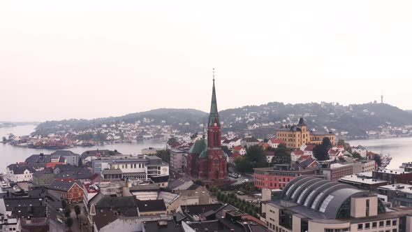 The Trinity Church Of Arendal City Surrounded By Norwegian Buildings and Houses in Agder County, Nor