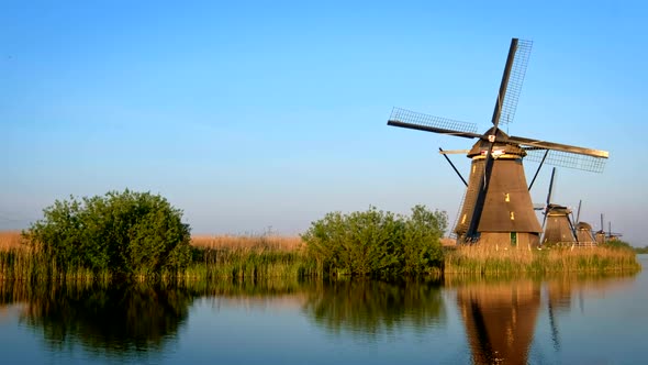 Windmills at Kinderdijk in Holland on Sunset. Netherlands