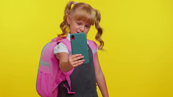 Schoolgirl Kid Blogger in Uniform Taking Selfie Recording Video on Mobile Phone for Social Media