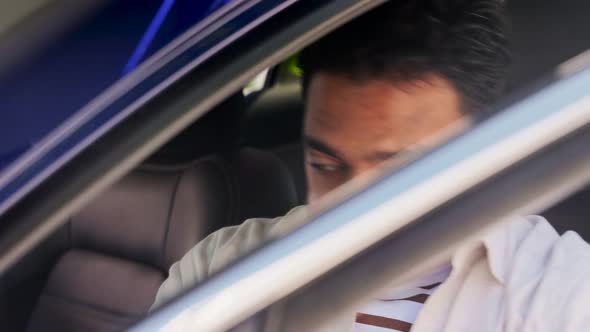 Smiling Indian Man or Driver Driving Car