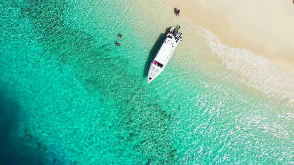 Viti Levu Island, Fiji - Tourists Enjoy the Bright Summer Day On The Beach Surrounded By Green Shall