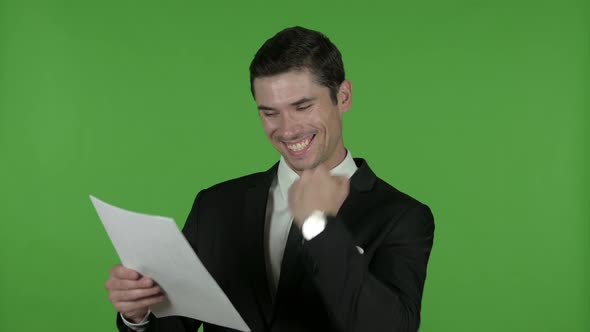Excited Young Businessman Reading Documents, Chroma Key