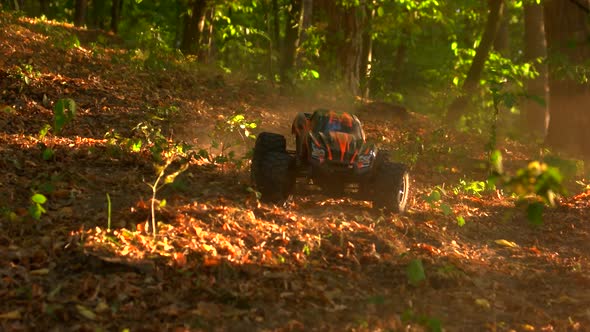 Monster Truck Rc Car Rides Over Dried Autumn Leaves.
