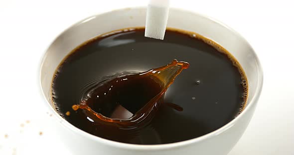 Sugar Falling into Bowl of Coffee, Slow Motion 4K