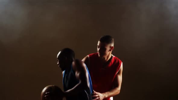 Sportsmen playing basketball