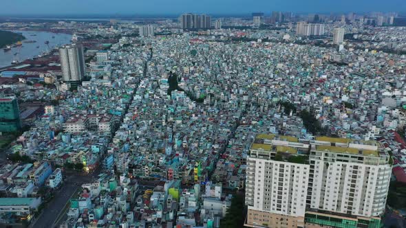 wide drone fly in over densely populated area and port of Saigon, or Ho Chi Minh City, Vietnam with