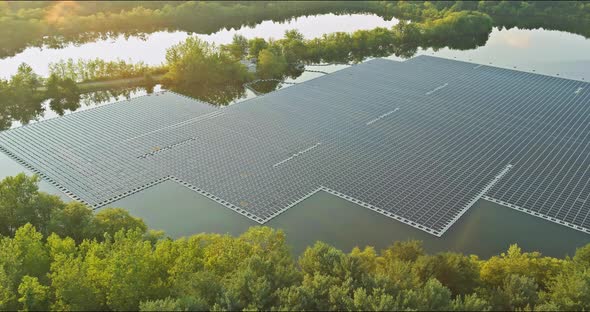 Aerial View of Lake in Floating Solar Panels Cell Platform on Renewable Green Solar Energy