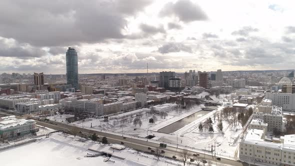 Aerial view of big winter city and river, dam and park 04