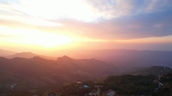 4K Aerial view over the mountains at sunset. Drone Flight Footage