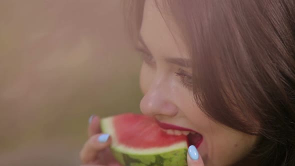 Pretty Woman Seductively Eating Watermelon