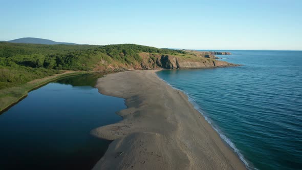 Exotic sandy beach surrounded by sea and river