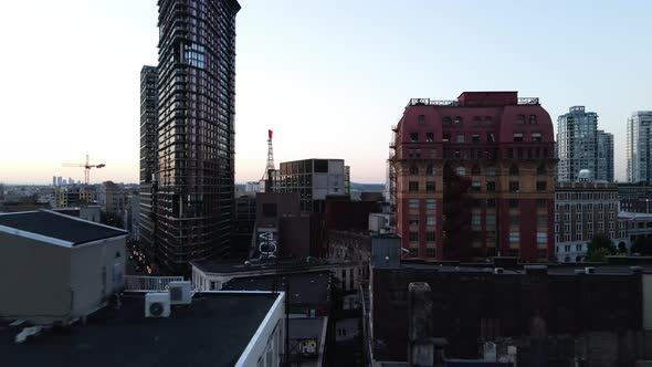 aerial drone footage of downtown Vancouver buildings, gastown, early sunrise, morning urban scrapers