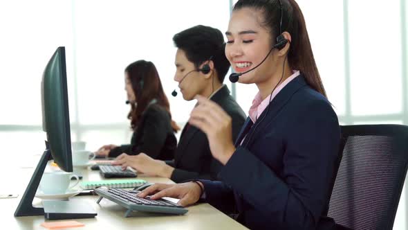 Business People Wearing Headset Working in Office