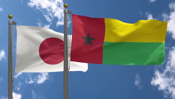 Japan Flag Vs Guinea Bissau Flag On Flagpole